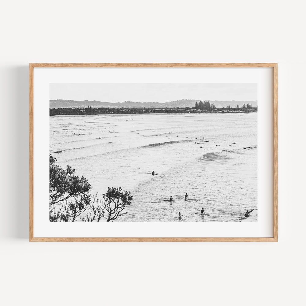 Experience the beauty of surfers at The Pass, Byron Bay with this framed art - a must-have for any art enthusiast.