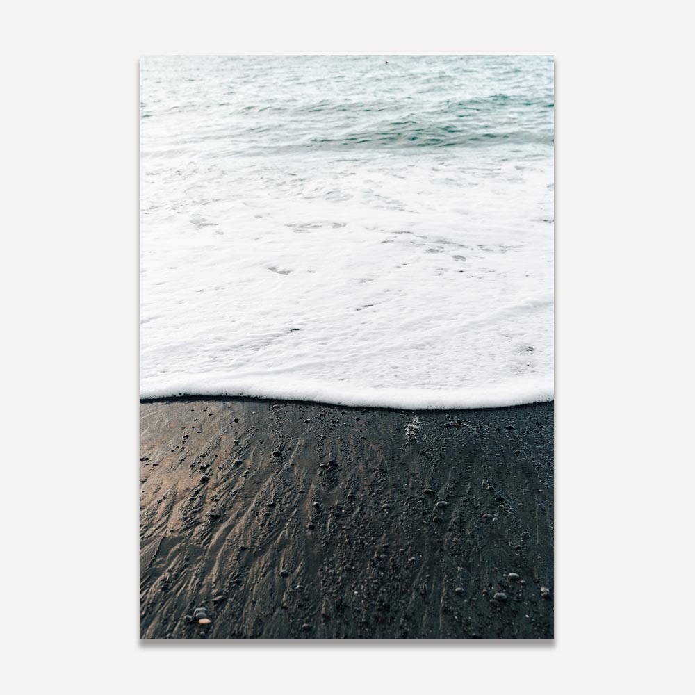 Wall art of Positano’s black sand beach with white waves washing ashore in a serene coastal scene