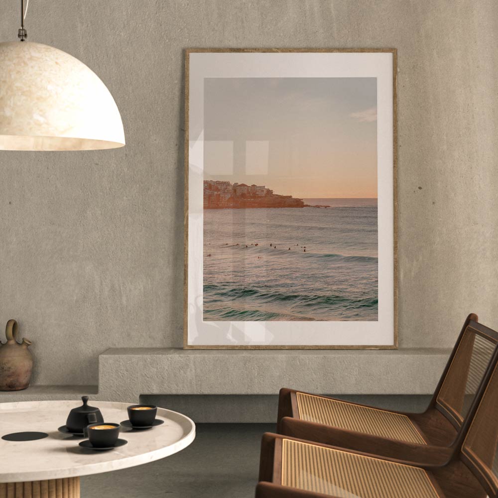 A captivating piece of real photography, this wall art captures the serene beauty of a sunrise at Bondi Beach.