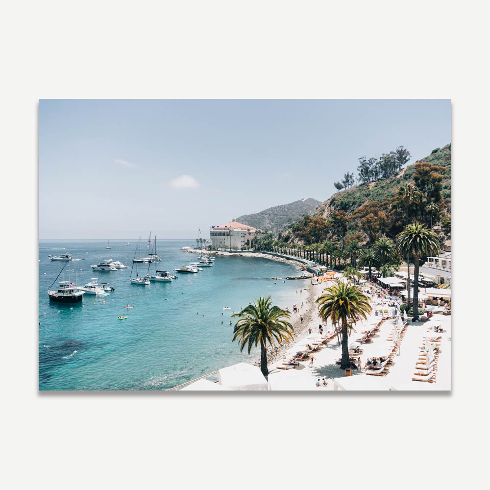 Real photography of a beach scene with palm trees and boats, great for wall art in homes and offices.