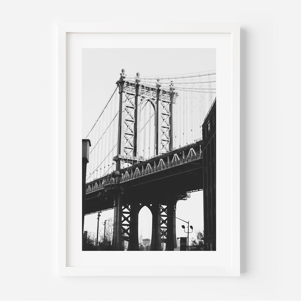 Iconic Dumbo Bridge, New York: Classic black and white framed photograph, perfect for wall art and home decor.