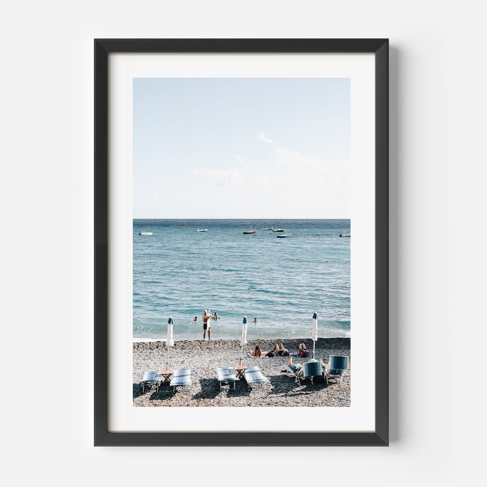 Fornillo Bathers enjoying the tranquility of Positano's coastline, a must-have for home decor aficionados.