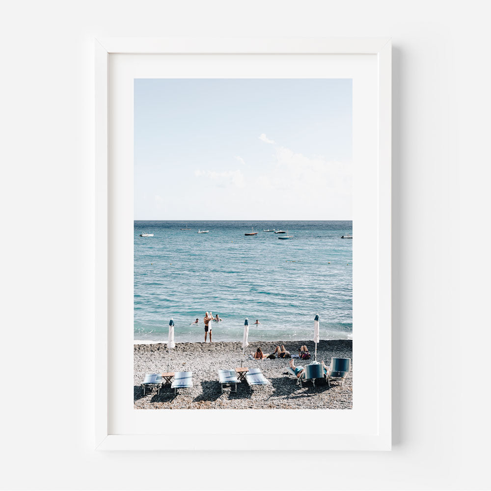 Positano Paradise: Bathers enjoying the Mediterranean vibes at Fornillo Beach, perfect for modern art enthusiasts.