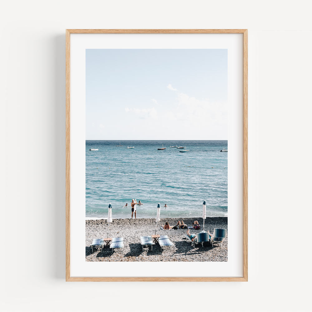 Coastal Lifestyle: Fornillo Beach bathers embody the essence of Positano, Italy, enhancing any wall art decor collection.