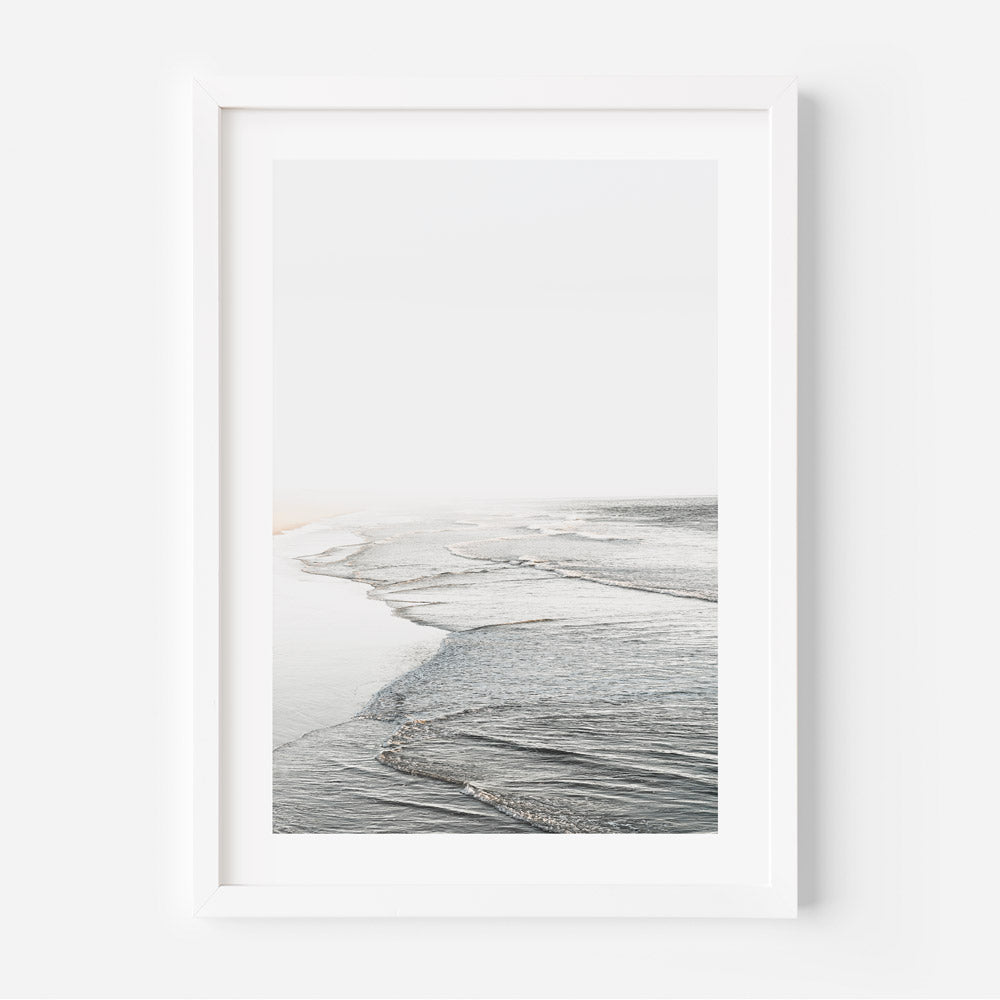 A white framed photo of ocean waves, perfect for wall art decor from Huntington Beach in California.