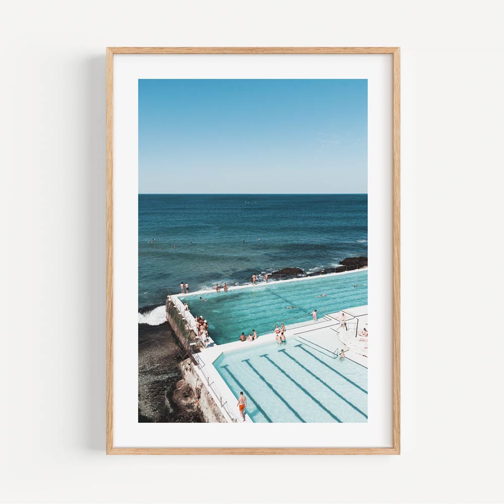 Enhance your space with Oblongshop's wall artwork: a framed photo showcasing Bondi Icebergs bathers, a captivating pool and ocean setting.
