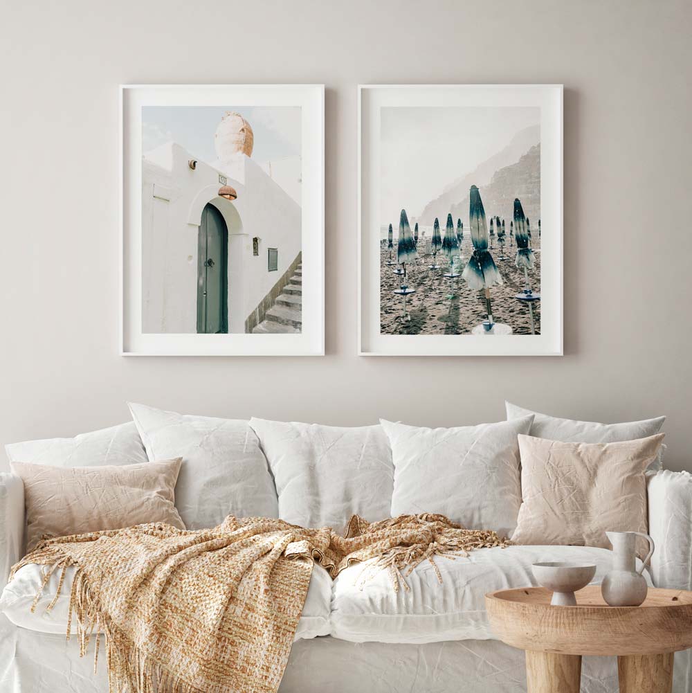 Wall art featuring a white framed photo of a doorway and stairs in Italy