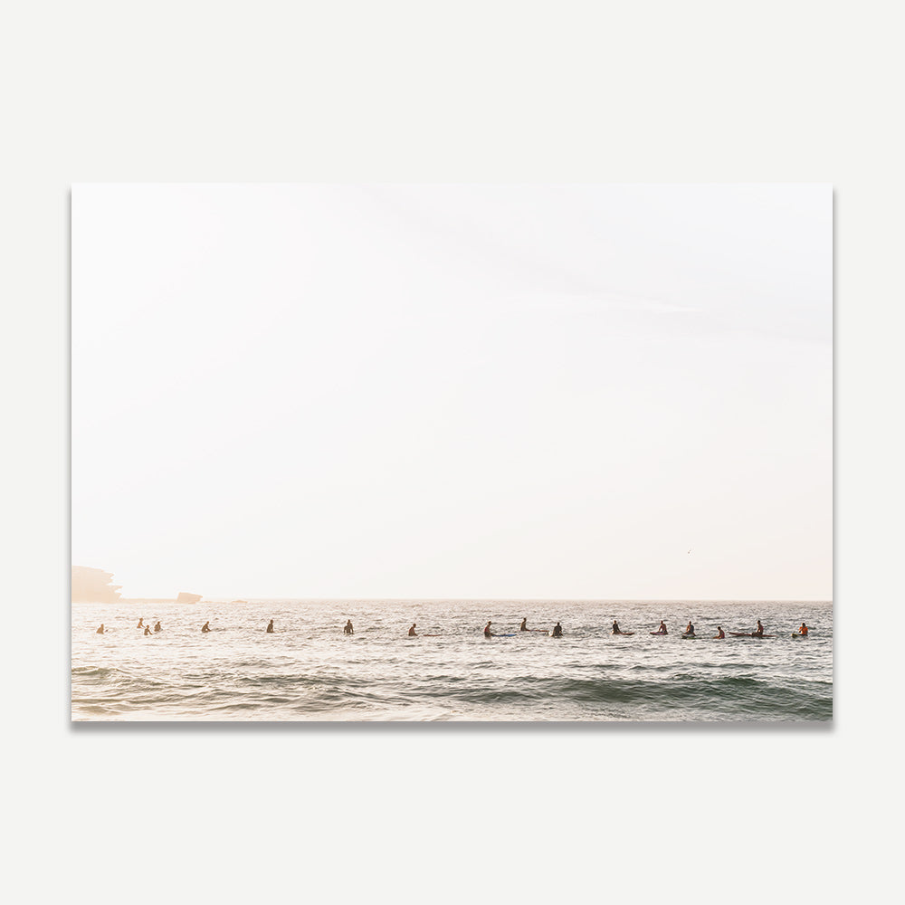 Bondi Beach morning wall art with surfers at sunrise – soft-toned coastal print for a peaceful and calming home decor look.