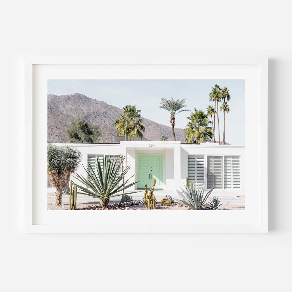 Palm Springs desert house with a mint green door - wall art decor for a cool and stylish living room.