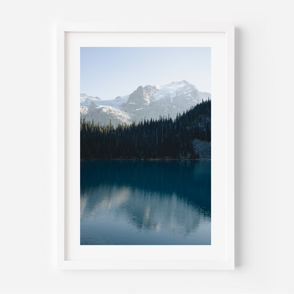 A framed photo of Mt. Matier, British Columbia, with mountains and a lake in the background.