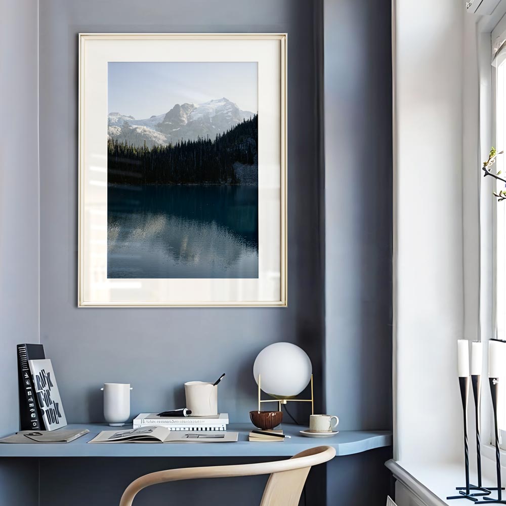 Wall art featuring a white-framed image of Mt. Matier, British Columbia, surrounded by mountains and a lake.