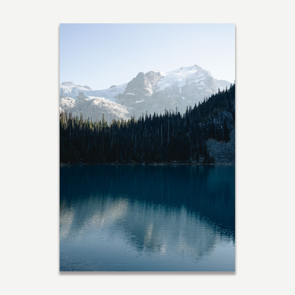 A white-framed photograph capturing the stunning view of Mt. Matier, British Columbia, with mountains and a lake.