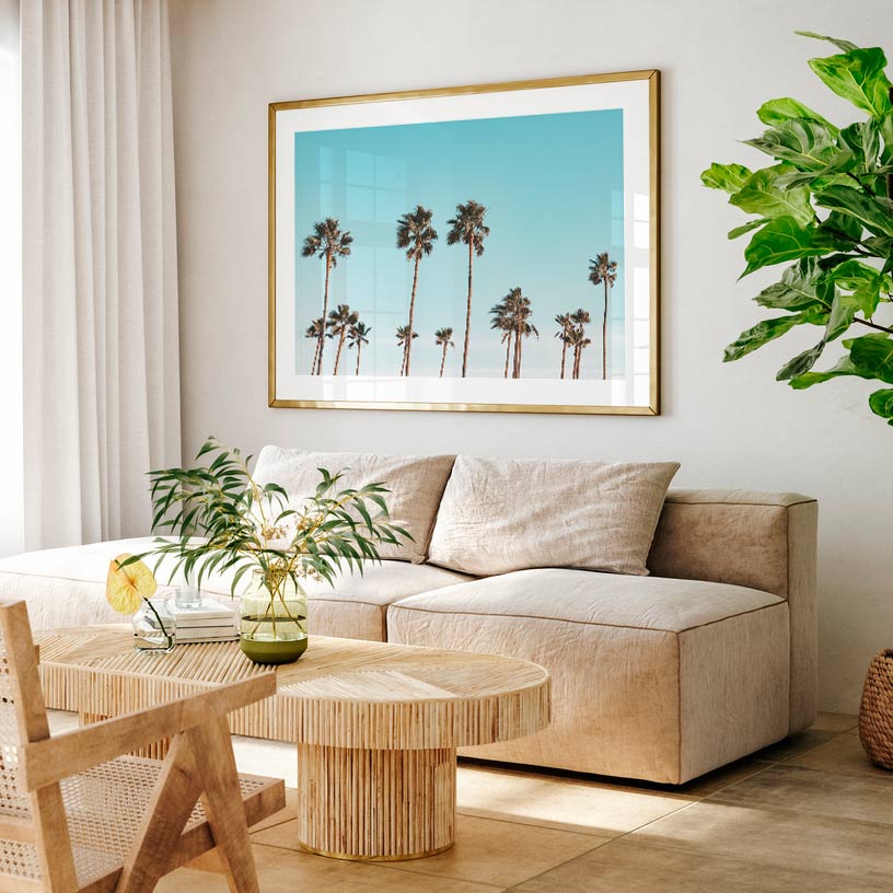 California palm trees framed against a blue sky - stunning wall artwork for your home or office.