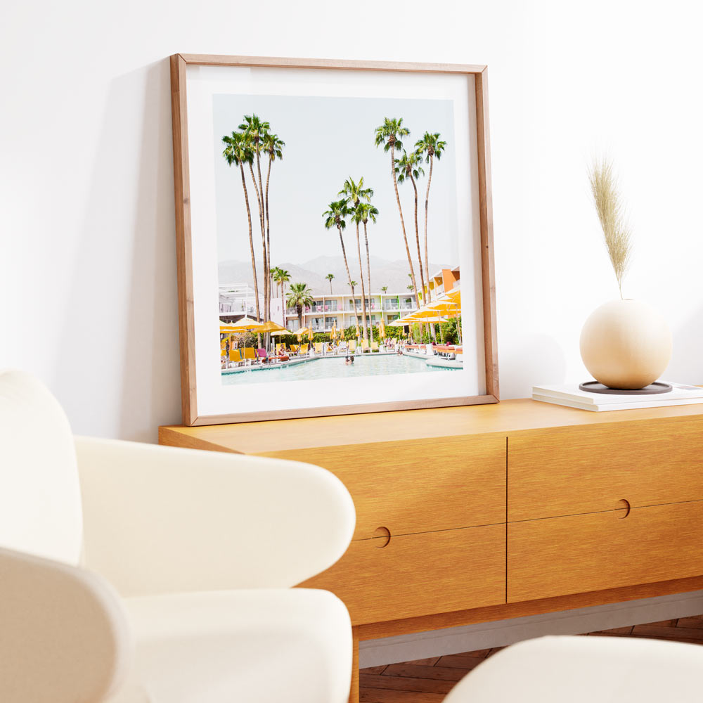 Wall art featuring a white framed photo of palm trees and a pool at The Saguaro Hotel in Palm Springs