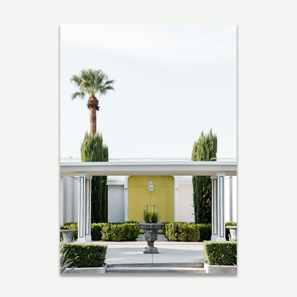 Brighten your home with OblongShop's summer wall art of a yellow door house in Palm Springs, perfect for vibrant decor.