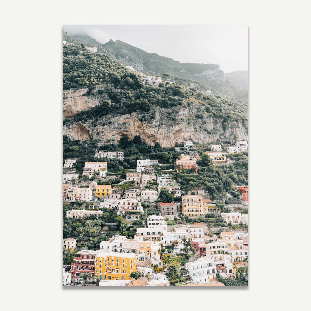 Explore the charm of Positano, Italy on the Amalfi Coast through this image capturing the vibrant houses against the seaside backdrop.