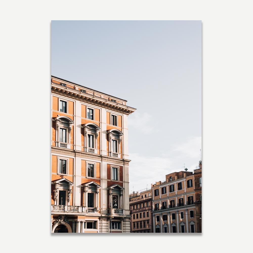 Sunlit orange Italian building wall art with vintage architectural charm