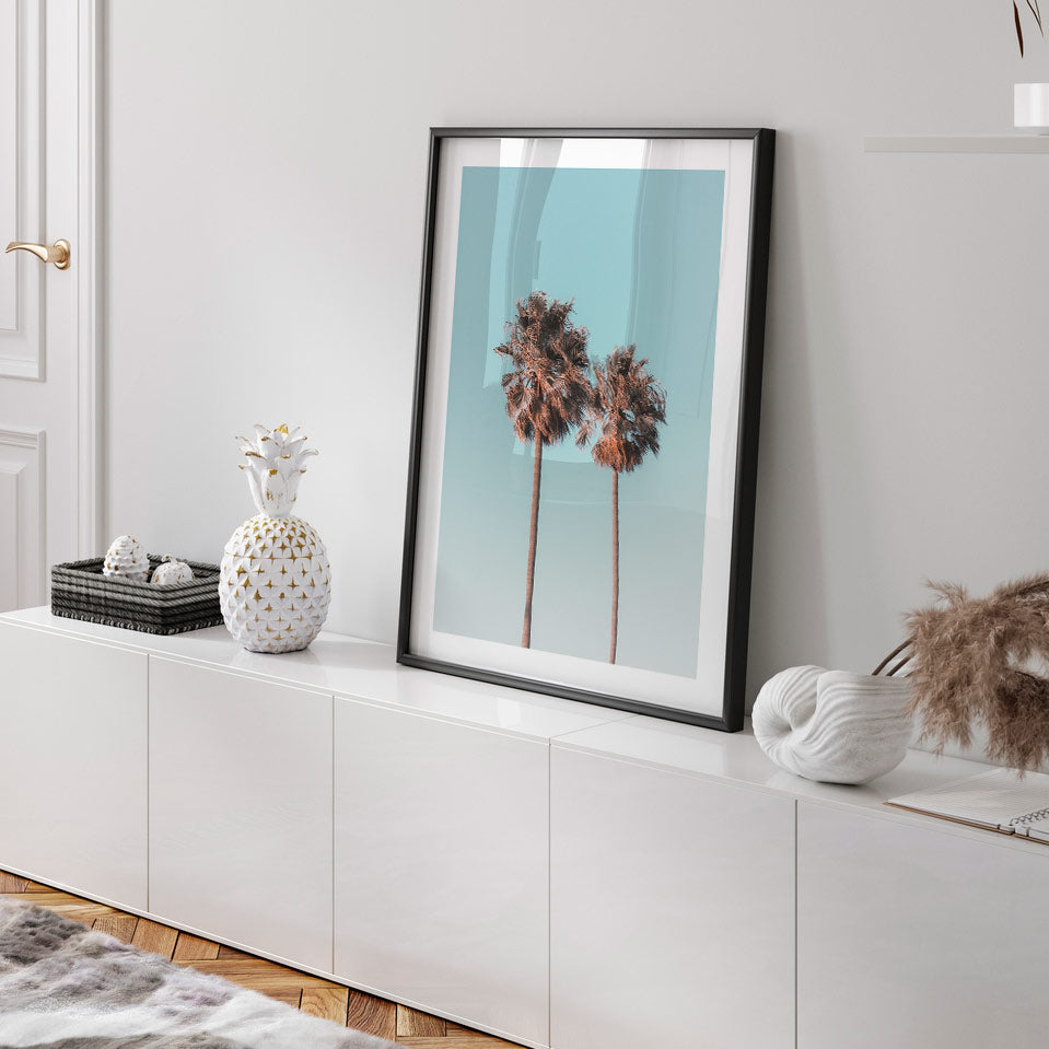 Iconic California Palms: Framed photo showcasing twin palm trees against a clear blue sky, ideal for prints shop collections.