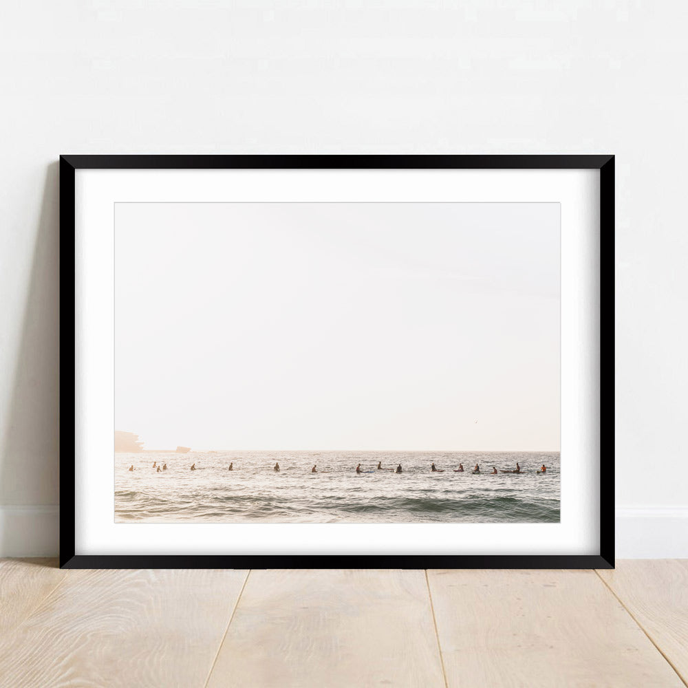 Real photography of surfers on the beach, ideal for wall artwork in homes and offices.