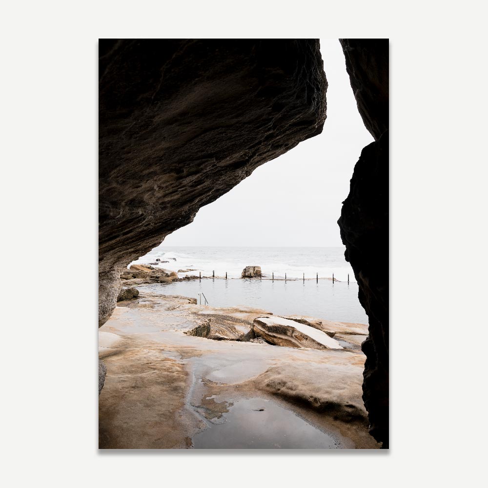 Immerse yourself in the beauty of nature with this wall art - a framed photo of a beach and rocks, perfect for any room, from Oblongshop.